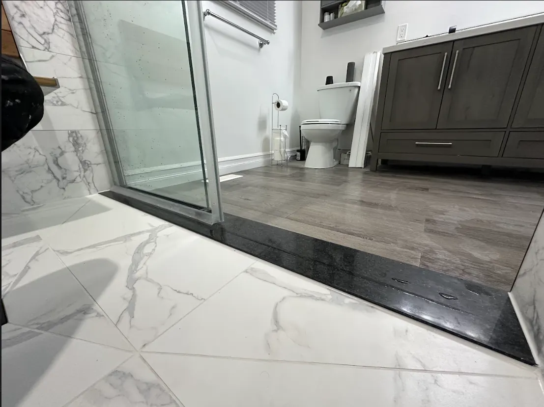 Accessible walk-in shower — Curbless Marble Threshold — Peterborough, Ontario