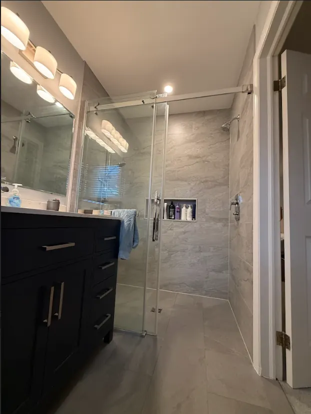 Walk-in shower — Curbless Walk-In Shower with Stone Tile — Peterborough, Ontario